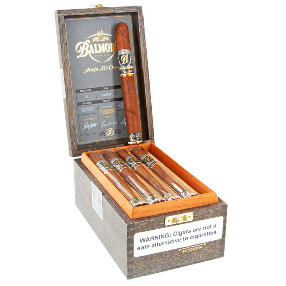 Scandinavian Tobacco Balmoral Anejo XO Oscuro Corona Cigars 20Ct. Box, open wooden cigar box containing five cigars with a detailed inside lid showing product information and a warning label.