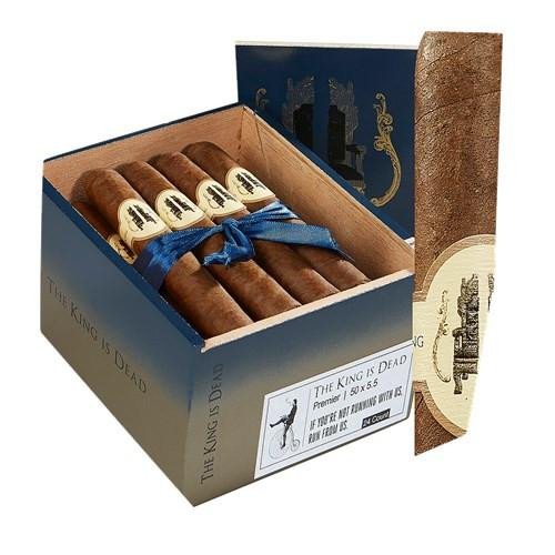 Caldwell Collection The King Is Dead Premier Cigars 24Ct. Box, open cigar box with four premium cigars inside, tied with a blue ribbon, displayed with its cylindrical outer packaging.