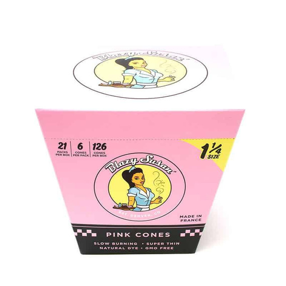 Blazy Susan 1 1/4 Pre-Roll Cone 21 Packs Per Box, packaging featuring a cartoon woman with dark hair and a blue dress, against a pink background with product details and specifications.