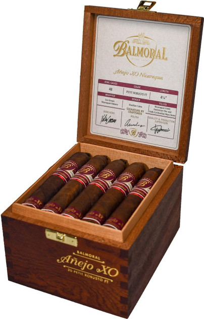 Scandinavian Tobacco Balmoral Anejo XO Nicaragua Petit Robusto FT Cigars 20Ct. Box, open wooden cigar box displaying five premium cigars with red and gold bands inside. The inside of the lid features detailed cigar specifications and signatures.