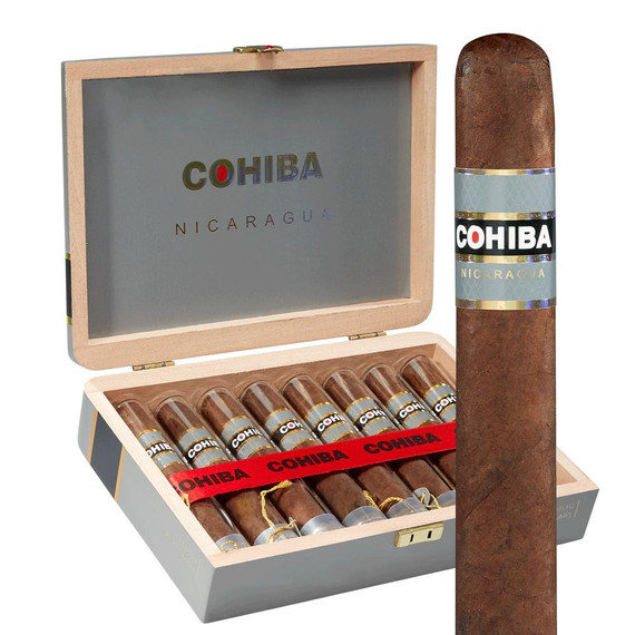 General Cigar Cohiba Nicaragua N En Crystale Cigars 8Ct. Box, an open wooden cigar box containing eight cigars with one cigar placed outside the box, featuring a sleek band with the Cohiba logo and Nicaragua branding.
