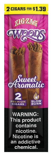 Republic Group Zig Zag Natural Leaf Woods Cigars Sweet Aromatic, two cigars in a brown leaf wrapper with aromatic filling, pink and black packaging design, featuring promotional offer '2 Cigars for $1.39' and a nicotine warning label.