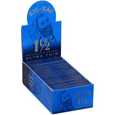 Republic Group Zig Zag Ultra Thin Blue Cigarette Papers 1 1/2, open blue box with multiple packs of ultra thin cigarette rolling papers inside.