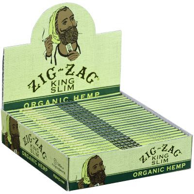 Republic Group Zig Zag Organic Hemp Rolling Cigarette Papers, green and yellow box with an illustration of a man with a beard and dreadlocks holding a paper, open box showing multiple rolling papers.