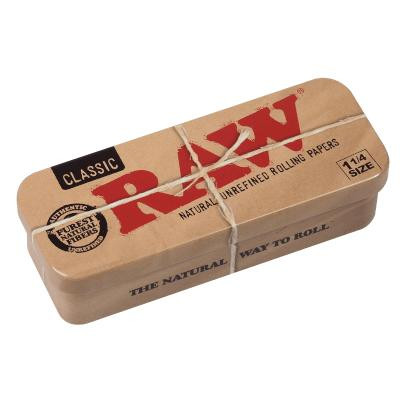 RAW Classic 1 1/4 Tins Caddy, a rectangular metal box with a cardboard sleeve packaging for natural unrefined rolling papers.