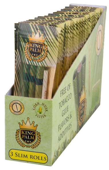 King Palm Wraps King Palm Slim Rolls 24/3Pk, a display box of cigarette wraps with multiple slim rolls inside, featuring green and gold packaging, a crown logo, and text highlighting natural ingredients and additive-free features.
