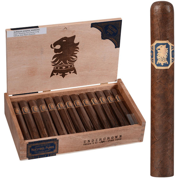 Undercrown Cigars Gran Toro 25 Ct. Box 6.00X52, open wooden cigar box containing 25 cigars with a single cigar standing outside the box, featuring the cigar's band with a lion emblem.