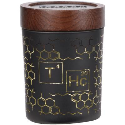 V Syndicate Smartstash THC Elemental Yellow Medium 4" Container, black container with gold chemical structures and wooden lid.