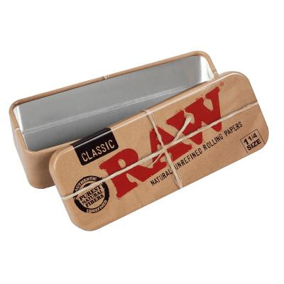 RAW Classic 1 1/4 Tins Caddy, a rectangular metal tin with a sliding lid containing RAW Classic natural rolling papers.