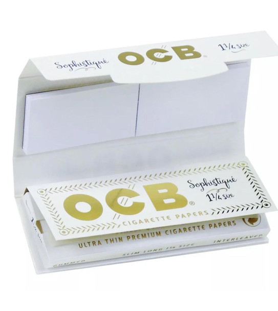 OCB Rolling Papers Sophistique 1 1/4 with Tips, empty white pack with gold and black text, opened to reveal paper inserts and tips for rolling cigarettes.