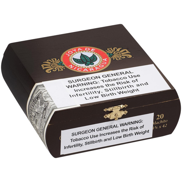 Joya De Nicaragua Cigars Antano 1970 Machito 20 Ct. Box 4.75X42, a dark brown cigar box with gold and red accents, featuring the Joya de Nicaragua logo and warning labels for tobacco health risks.