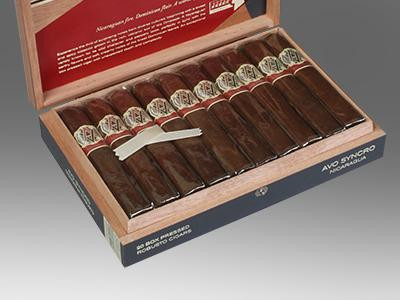 AVO Cigars Syncro Nicaragua Robusto 20 Ct. Box, open wooden cigar box displaying cigars with band labels and a white humidifier inside.