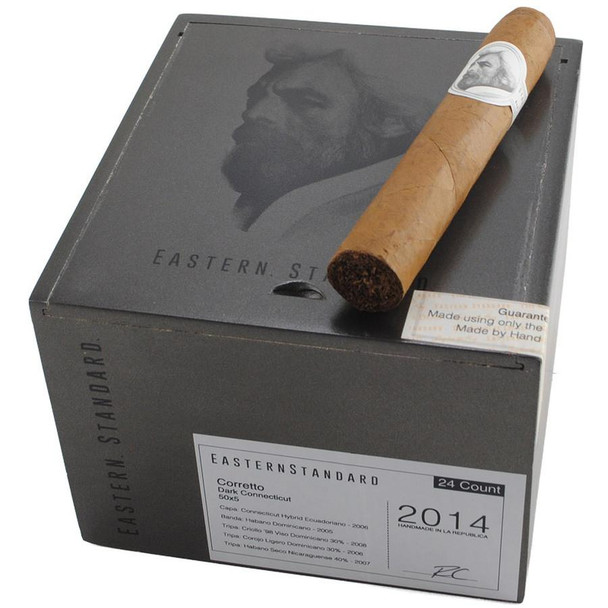 Caldwell Collection - Eastern Standard Corretto Cigars 24Ct. Box, showing a sealed box of cigars with a cigar placed on top, featuring a label and artwork of a bearded man.