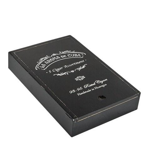 La Aroma de Cuba & San Cristobal Cigar Sampler 5Ct, black rectangular box with white decorative text and design, containing a selection of premium cigars.