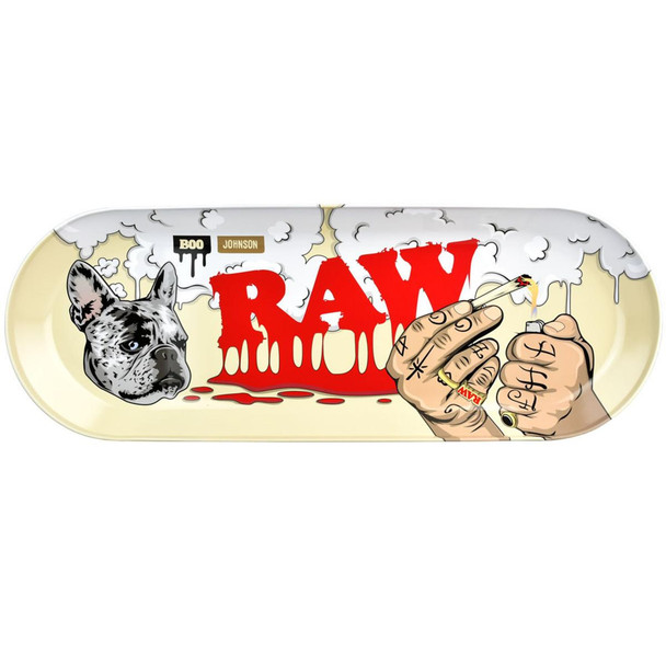 RAW X Boo Johnson Skate Deck Metal Rolling Tray - 16.75x6, featuring a graphic of a French Bulldog's face, bold red 'RAW' logo, and tattooed hands holding a lit cigarette with smoke and graffiti-style drips.