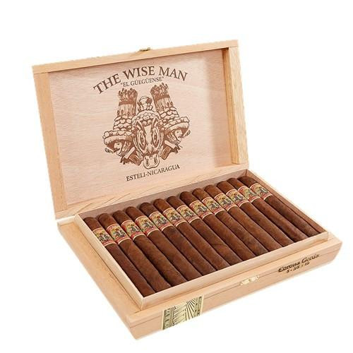 The Wise Man Maduro El Gueguense Cigars, a wooden box filled with long, dark Maduro cigars with decorative bands, displayed open showing the cigars inside.