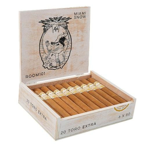 Room 101 Miami Snow Cigars, open wooden box containing 20 Toro Extra cigars with gold and white bands.