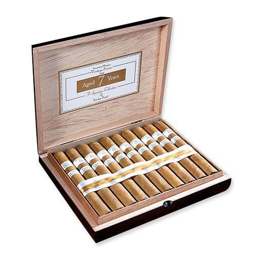 Rocky Patel Vintage 1999 Connecticut Cigars, a wooden box containing numerous cigars neatly arranged with white bands