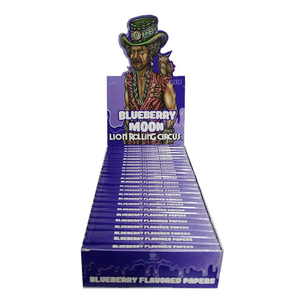 Lion Rolling Circus 1 1/4" Blueberry Rolling Papers, display of blueberry flavored rolling papers in purple packaging with a graphic of a man in a colorful outfit and hat.