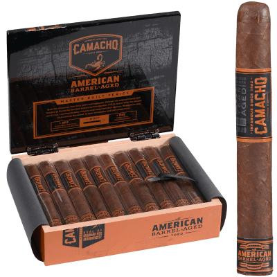 Camacho American Barrel-Aged Cigar Toro 20 Ct. Box, opened box displaying individually wrapped cigars and one cigar standing upright beside the box.