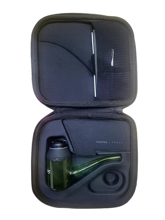Ruckus Glass Proxy Glass Attachment- Green, inside view of a black carrying case with protective foam, containing a green glass proxy with a black top and a black cleaning cloth, suitable for vaping devices.