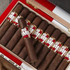 Romeo by Romeo y Julieta Cigars, a box containing multiple dark brown cigars with gold and white bands, one cigar is removed and placed on top of the box.