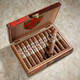AJ Fernandez Ave Maria Ark of the Covenant Cigars 20Ct. Box, open wooden cigar box containing 20 cigars with decorative bands. AJ Fernandez Ave Maria Ark of the Covenant Cigars 20Ct. Box, open wooden cigar box containing 20 cigars with decorative bands.