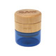 RAW Natural Wood Grinder, a compact grinder with a natural wood top and a blue bottom container for grinding herbs or spices.