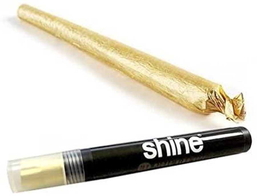 Shine Rolling Paper Shine 24K Gold Pre-Roll Cone Kingsize, gold foil-wrapped cone and black rolling paper tube with white Shine logo.
