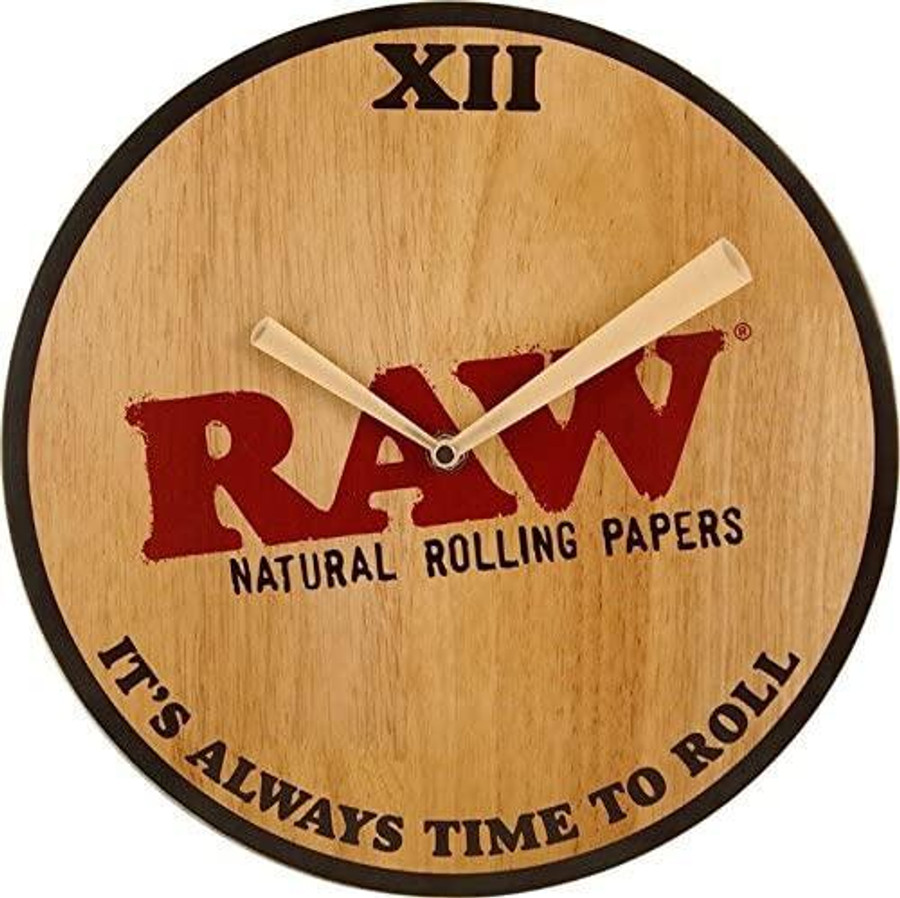 RAW Papers Wood Wall Clock, round wooden clock with black rim, natural wood finish, and bold text displaying 'RAW' and clock hands showing time, decorative and functional wall art.