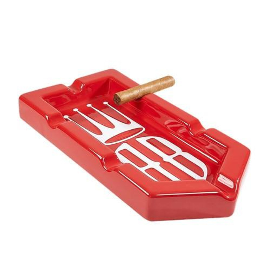 Alec Bradley Badge 6-Finger Ashtray Red, image of a red cigarette ashtray with six slots for cigars and a cigar resting on it.