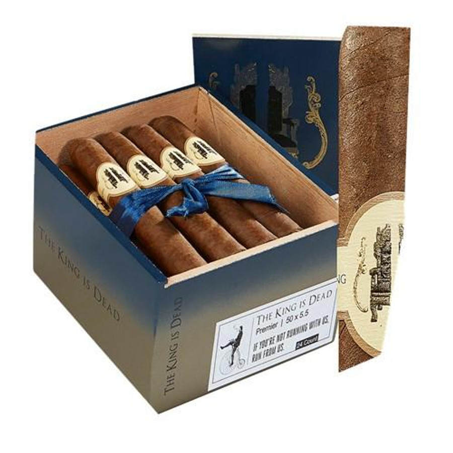 Caldwell Collection The King Is Dead Premier Cigars 24Ct. Box, open cigar box with four premium cigars inside, tied with a blue ribbon, displayed with its cylindrical outer packaging. Caldwell Collection The King Is Dead Premier Cigars 24Ct. Box, open cigar box with four premium cigars inside, tied with a blue ribbon, displayed with its cylindrical outer packaging.