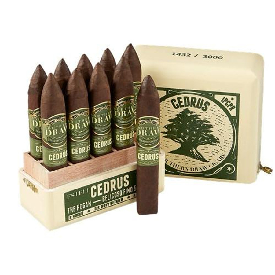 Southern Draw Cedrus Cigars, a box of premium cigars with several cigars displayed outside in their green and gold labels, and a soap bar with Cedrus logo.