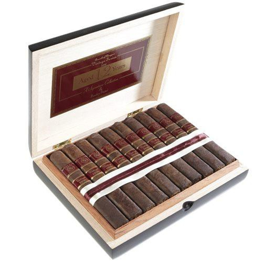 Rocky Patel Vintage 1990 Cigars, a wooden box containing a neatly arranged set of premium cigars with red and gold bands.