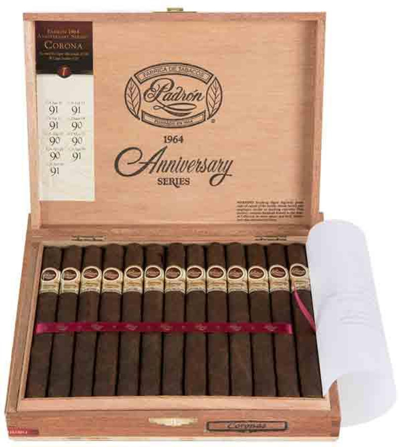 Padron 1964 Anniversary Series Corona Maduro Cigars 25 Ct. Box, open wooden cigar box containing 25 cigars arranged neatly with gold and white bands, featuring a pull-out tray and a pink ribbon, with the product name and details on the inside lid.