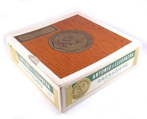 Altadis AYC Grenadiers Natural Dark Box Cigars, boxed cigars with woodgrain design and gold embossed logo on the packaging.