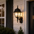 Decorative Black Coach Outdoor Wall Lantern Clear Beveled Lens - Scroll Arm Finial 