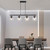 Volume Lighting V1594-5 - 4-Light Black Linear Island Pendant - Clear Glass Globes