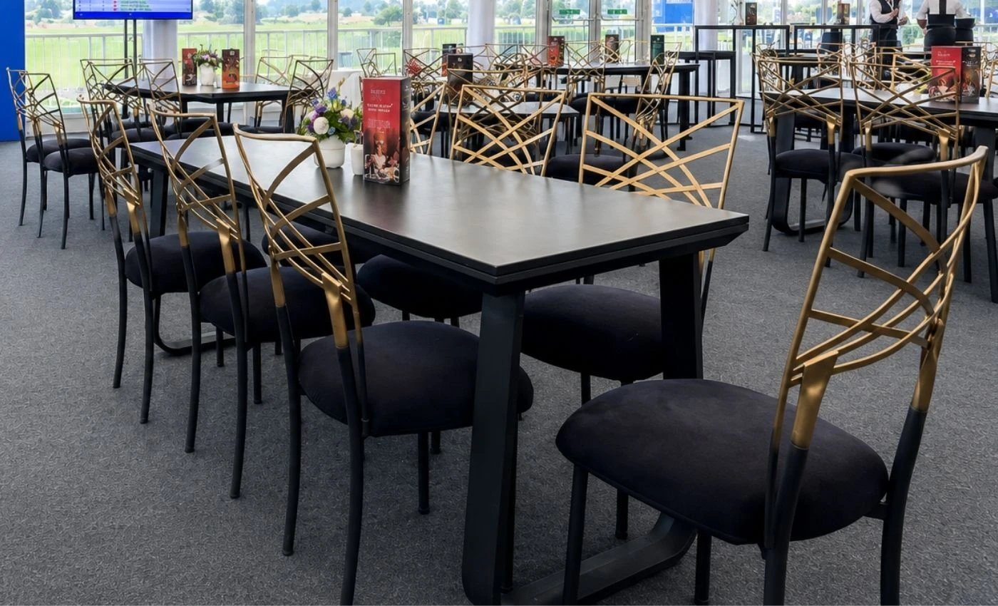 Flow dining table with Chameleon chairs at the KPMG Women's Irish Open hospitality marquee