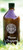 Bruine glazen fles Bormo Shampoo van 1000 ml op gras