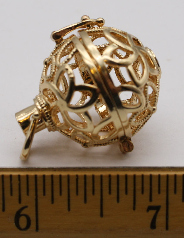 Gold colored stone cage spherical locket