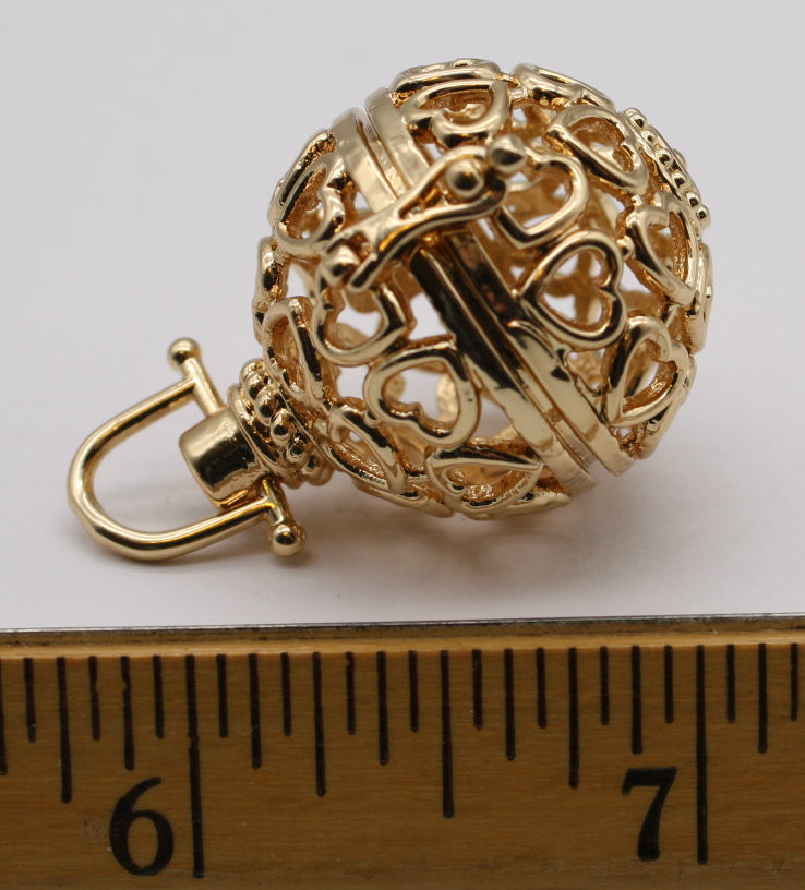 Gold colored stone cage spherical locket