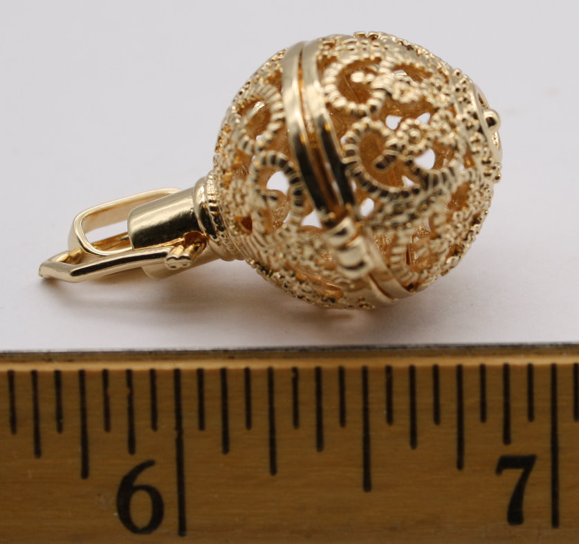 Gold colored stone cage spherical locket
