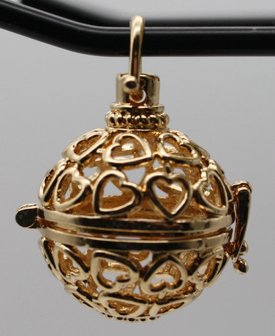 Gold colored stone cage spherical locket