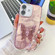 iPhone 16 Plating Glitter Lens Film Texture Butterfly Holder Wristband Phone Case - Pink Feathers