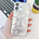 iPhone 16 Plus Plating Glitter Texture Fold Holder TPU Phone Case with Lens Film - White Feathers
