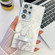 Samsung Galaxy S25 Ultra 5G Plating Glitter Texture Fold Holder TPU Phone Case with Lens Film - White Feathers Samsung Galaxy S25 Ultra 5G Plating Glitter Texture Fold Holder TPU Phone Case with Lens Film - White Feathers