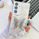 Samsung Galaxy S25+ 5G Plating Glitter Lens Film Texture Butterfly Holder Wristband Phone Case - White Water Ripples