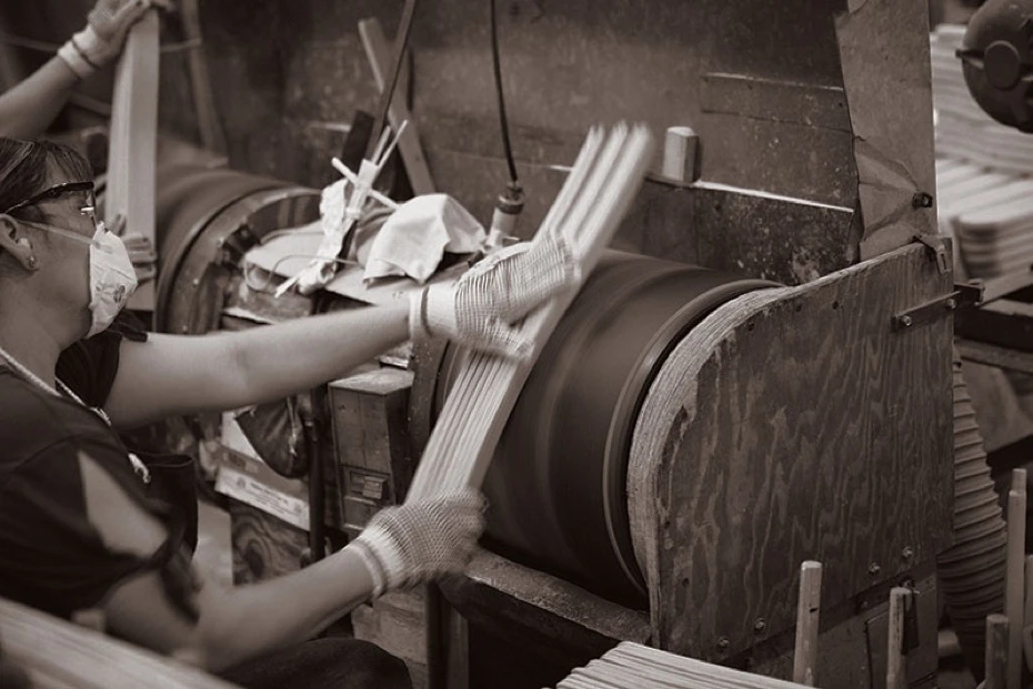 Troutman Chair Company craftsperson working on solid wood furniture in North Carolina