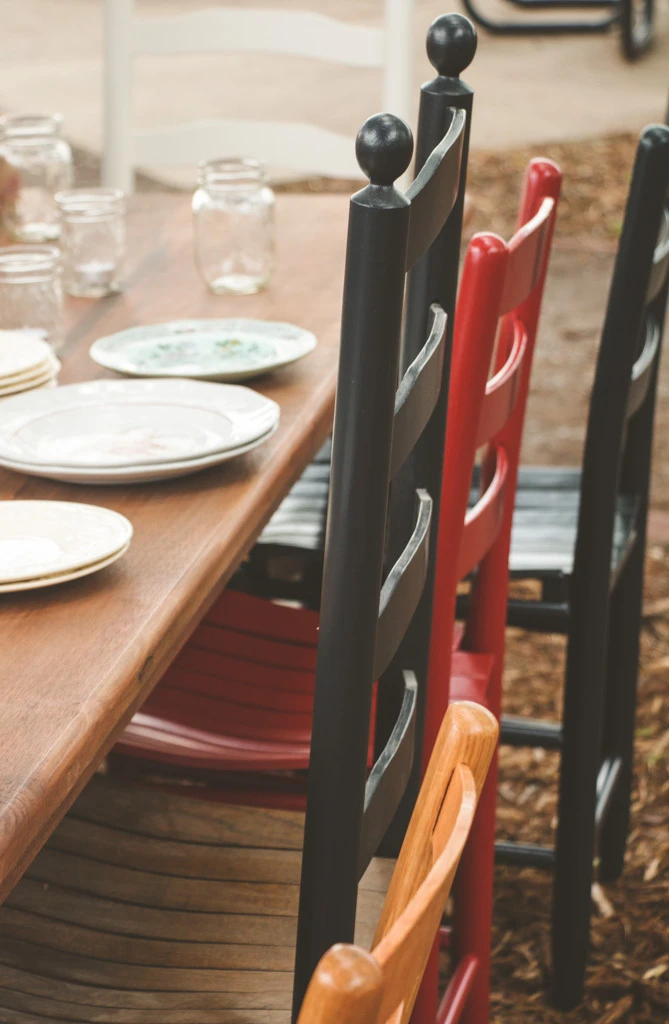 American made chairs in coordinated painted finishes around a table